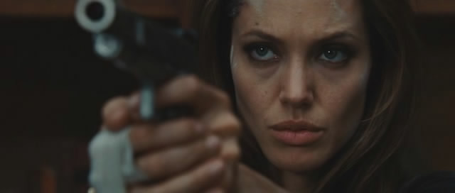 Angelina Jolie shows off her gun.
